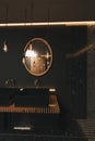 3d rendering of precious black bathroom with wooden mirror and illuminated lightbulbs