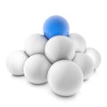 3D rendering of a pyramid of white balls with a blue ball on top isolated on a white background