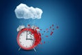 3d rendering of red alarm clock standing under raining cloud and dissolving in particles on one side, on blue background