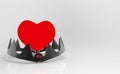 3d rendering. Red heart on teeth jaw trap on white background. Risk in love concept