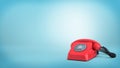 3d rendering of a red retro rotary phone with a black cord stands unused on blue background. Royalty Free Stock Photo