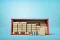 3d rendering of red shipping container filled with packs, bricks and wooden pallets on blue background Royalty Free Stock Photo