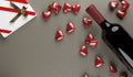 3D Rendering Of Red Wine Bottle With Opened Gift Box Full Of Red Hearts