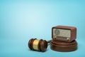 3d rendering of retro radio set on sounding block with brown gavel lying beside on light-blue background with copy space Royalty Free Stock Photo