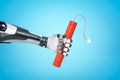 3d rendering of robotic hand holding red TNT dynamite stick on blue background Royalty Free Stock Photo