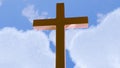 wooden cross against a backdrop of fluffy white clouds Royalty Free Stock Photo