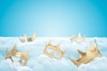 3d rendering of set of gold crowns on thick layer of white fluffy clouds with blue sky above. Royalty Free Stock Photo