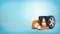 3d rendering of a several car wheels stacked on one another beside several orange and white traffic cones.