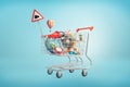 3d rendering of shopping cart filled with such things as an Earth globe, phone, iron ball, piggy bank, golden egg and Royalty Free Stock Photo