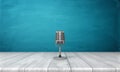 3d rendering of a single metal retro microphone placed on its short stand over a wooden desk. Royalty Free Stock Photo