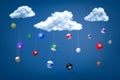 3d rendering of snooker balls falling down from three white fluffy clouds in the blue sky.