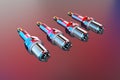 3D rendering. Spare parts spark plugs on multicolored background for car and motorcycle