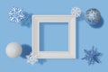 3d rendering square picture frame mockup, snowflakes and balls with frosty texture on a blue background