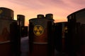 A stack of barrels with radioactive material abandoned in the desert Royalty Free Stock Photo