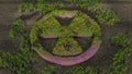 3d rendering of stone surface and radiation sign covered with grass and flowers. Illustration of the ecological movement,