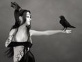 3D rendering of grayscale woman with black crow