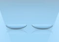 3d rendering. Thin clear contact lens on light blue copy space background