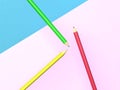 3d rendering of three coloured pencils on multicoloured background, back to school concept