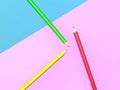 3d rendering of three coloured pencils on a multicoloured background