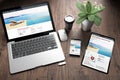 three devices on wooden desk top view directory resort Royalty Free Stock Photo