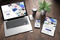 three devices on wooden desk top view website builder Royalty Free Stock Photo