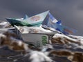 Three paper boats made of US dollar, Euro and Swiss Franc banknotes floating on stormy water