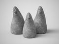 3D rendering of three stone figures with faces Royalty Free Stock Photo