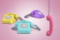 3d rendering of three telephones, purple, yellow and turquois, on a pink background with a pink receiver hanging on its Royalty Free Stock Photo