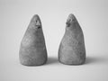 3D rendering of two stone figures with faces Royalty Free Stock Photo