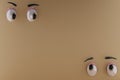 3D Rendering Of Unique Eyes, Glares and Pity emotion. and Brown Paper Background