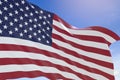 3D rendering of USA flag waving on blue sky background Royalty Free Stock Photo