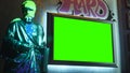 3D rendering Virtual studio with old Greek sculpture painted with graffiti and displays with green screen banners mock