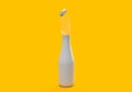 3d rendering of white bottle and lid with water splash on yellow background. 3d bottle are opening mock up concept for brand Royalty Free Stock Photo