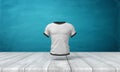 3d Rendering Of White Close-fitting Men`s T-shirt With Black Edge Piping, Suspended In Air Above Wooden Surface On Blue