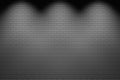 3d rendering. white spot lights shine on gray brick blocks wall background.