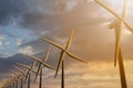 3D rendering of windmills producing engergy in the evening Royalty Free Stock Photo