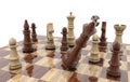 3D rendering of a wooden chessboard with king falling over after checkmate- strategy concept