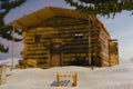 3d rendering of wooden sledge covered with snow in front of log