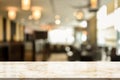 3D Rendering, Wooden top table with bokeh light effect and blur restaurant on background, blur background Royalty Free Stock Photo