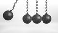 3d rendering of a wrecking ball swinging on white background beside three still hanging balls on white background. Royalty Free Stock Photo