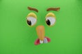 3d rendering of zoom emoticon angry, looked down and green colors wall