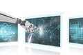 3D robot hand interacting with medical interfaces against white background Royalty Free Stock Photo