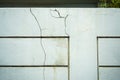 Cracked walls on the fence due to substandard construction by the contractor. Royalty Free Stock Photo