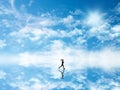 3D silhouette of a female jogging against a sky which is reflected in ground