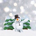 3D snowman on silver Christmas background with mounds of snow Royalty Free Stock Photo