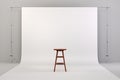 3d studio setup with wooden chair and white background Royalty Free Stock Photo