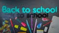 3d text Back to school on a chalckboard with school objects Royalty Free Stock Photo