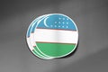 3D three flag stickers of Uzbekistan on dark gritty background.