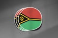 3D three flag stickers of Vanuatu on dark gritty background.