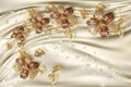 3D wallpaper, gold jewelry flowers on silk background.